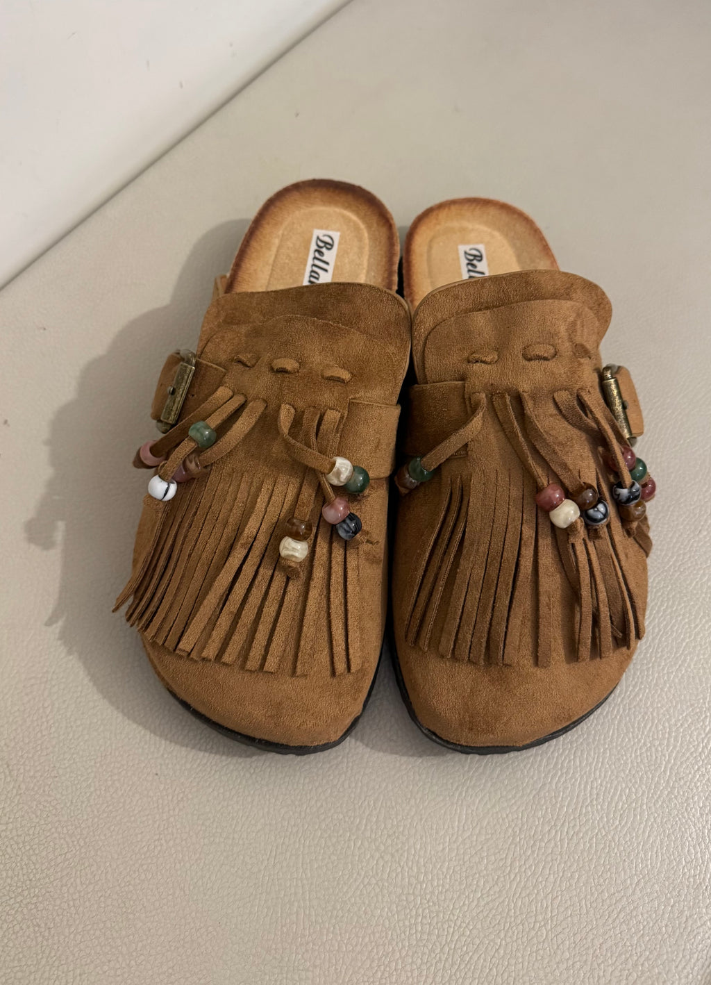 Mules con frange e perline