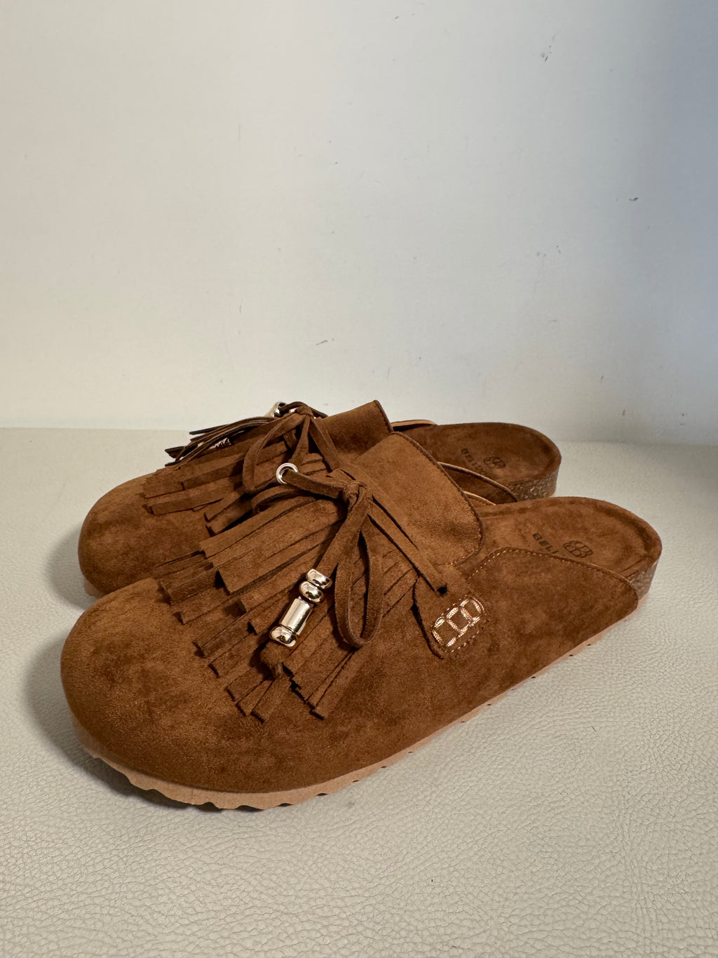 Mules con frange